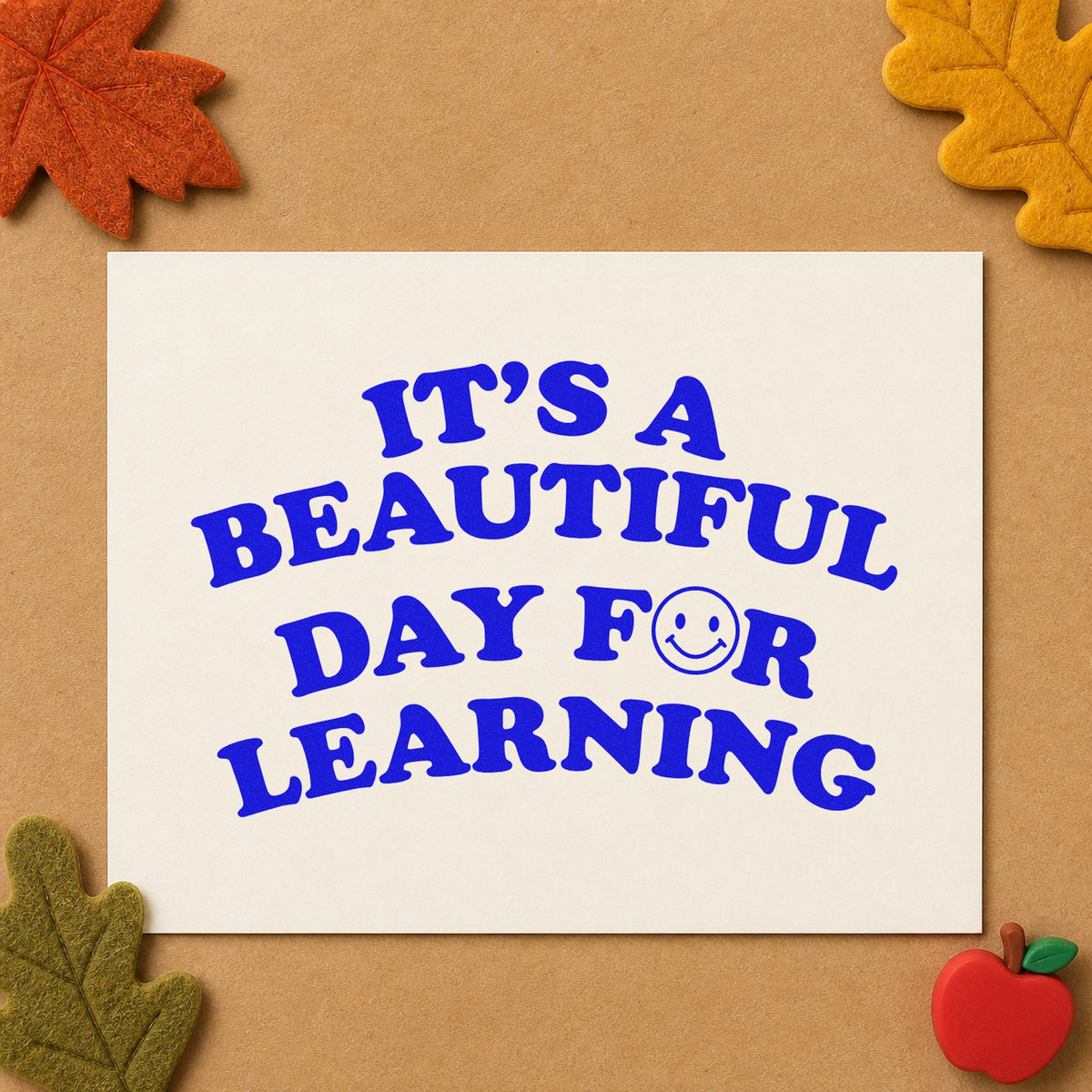 Beautiful Day For Learning Smile craft stamp imprinted in blue ink on paper, a design suited to postcard home seals.
