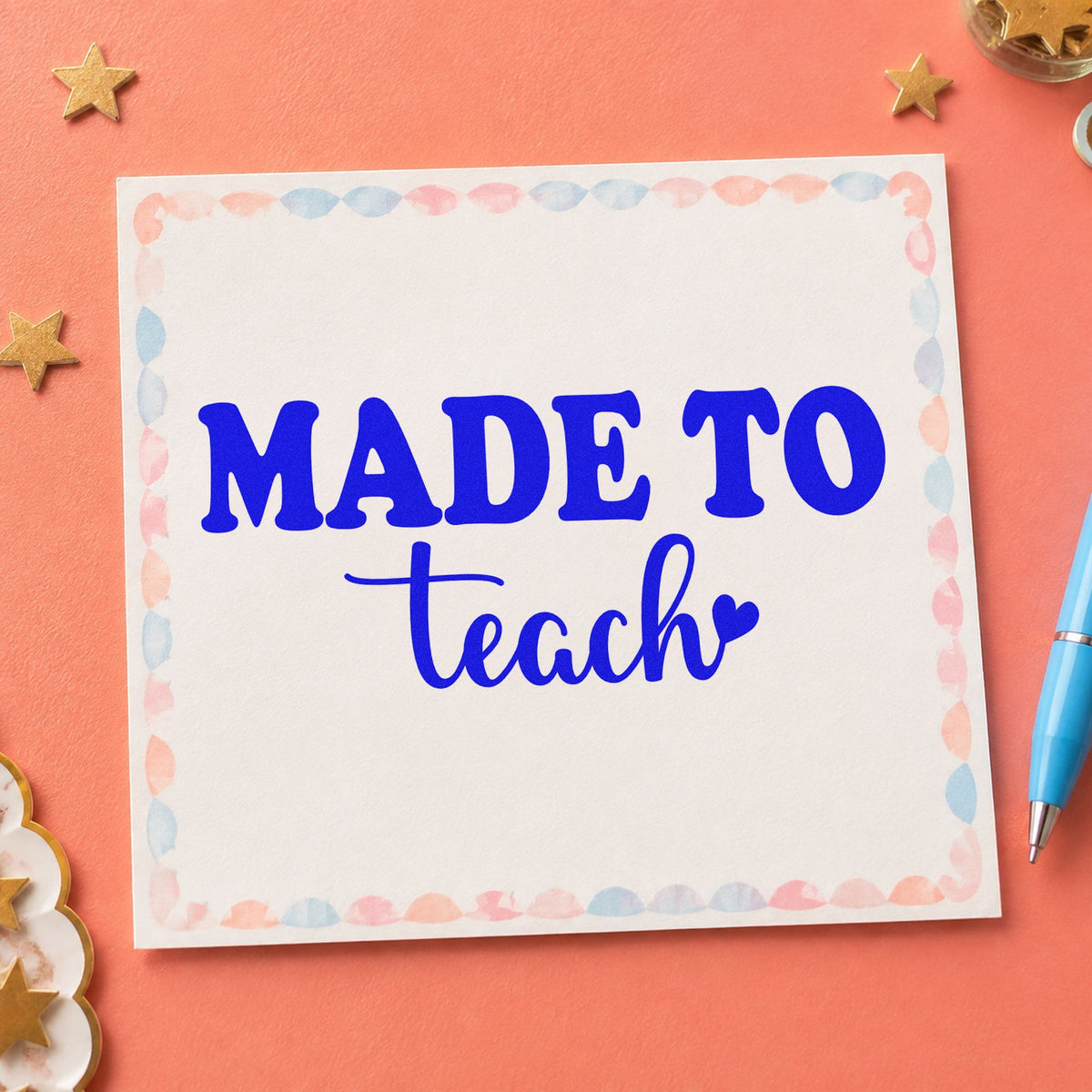Made To Teach Heart craft stamp in blue ink on cardstock, an easy option for satchel flap panels.