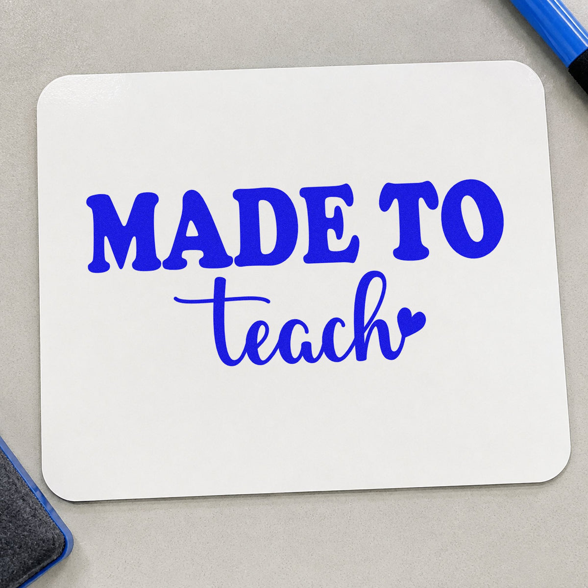 Made To Teach Heart craft stamp imprinted in blue ink on paper, a design suited to offer letter seals.