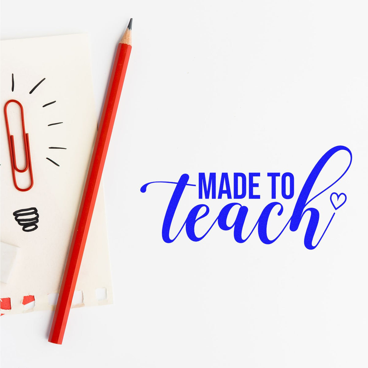 Blue Made to Teach teacher stamp and seal design with red pencil and paperclip on white paper