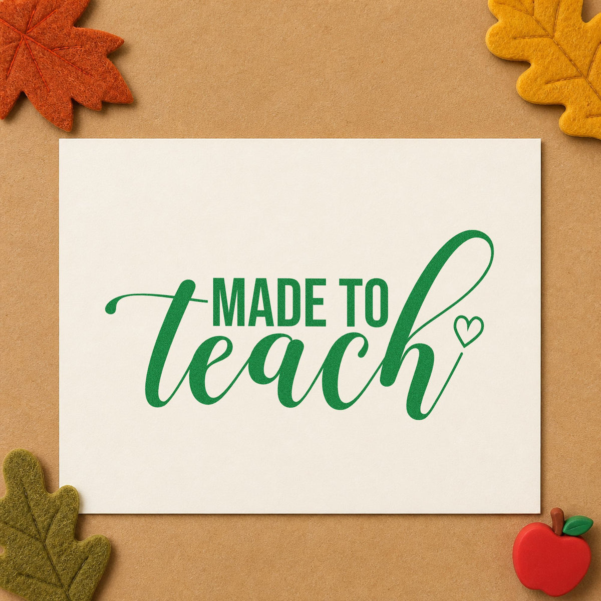 Made To Teach Outline Heart craft stamp imprint in green ink on a handmade project, one idea being framed light wall.