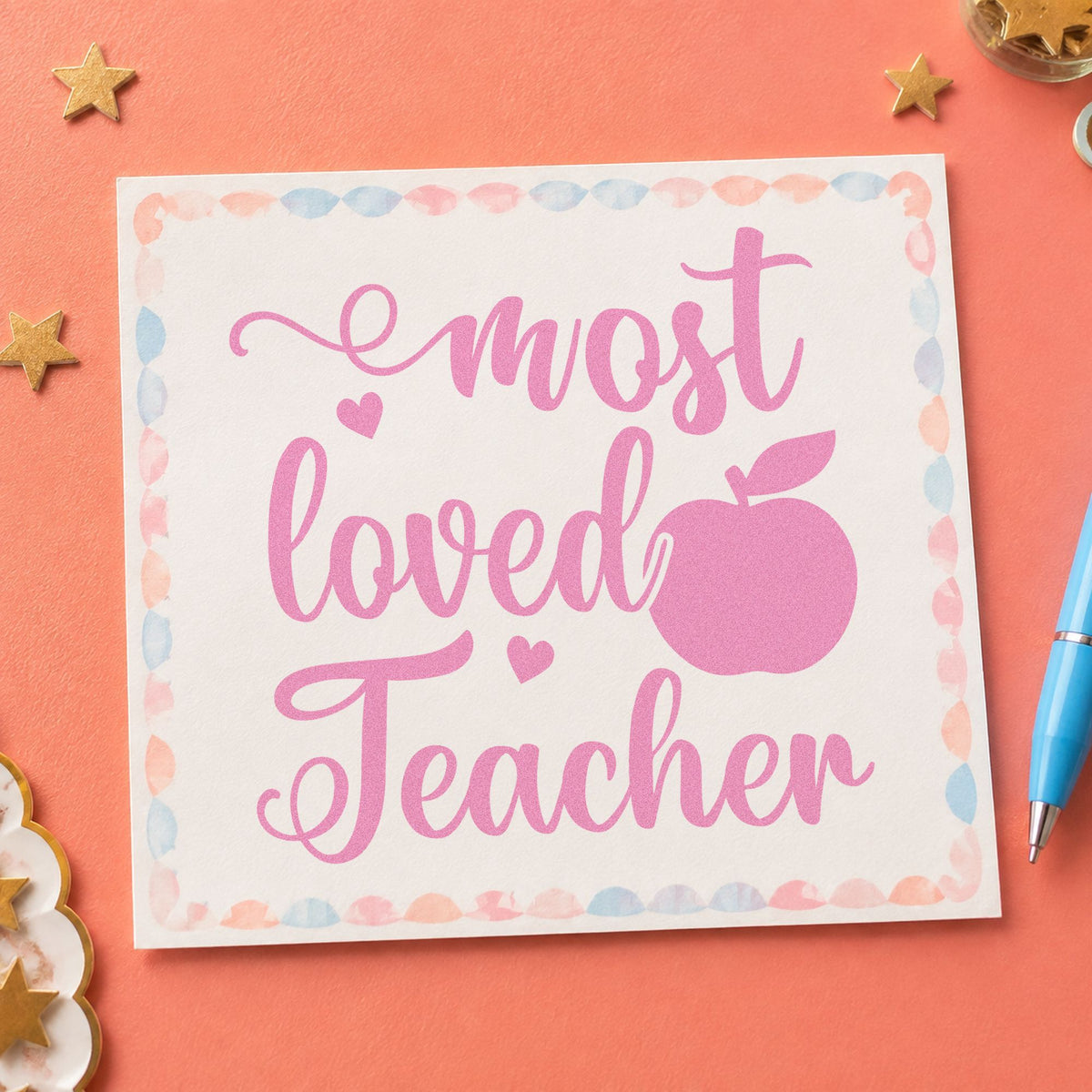 Most Loved Teacher Apple craft stamp in purple ink on cardstock, an easy option for class vote tags.