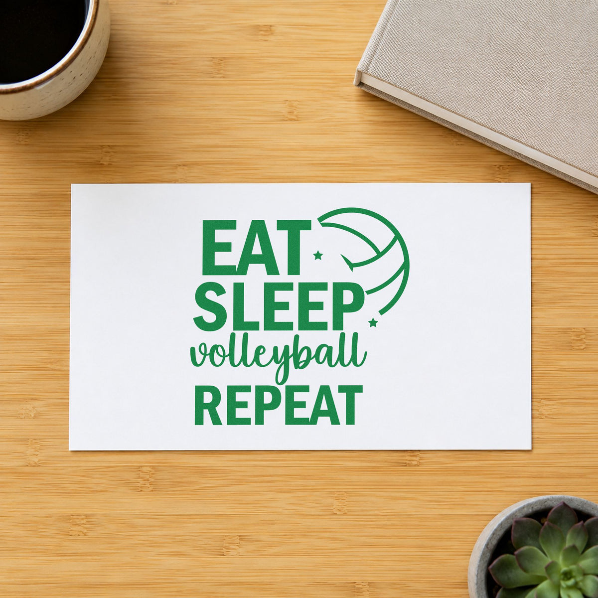 Eat Sleep Volleyball Repeat craft stamp imprint in green ink on a handmade project, one idea being framed court side.