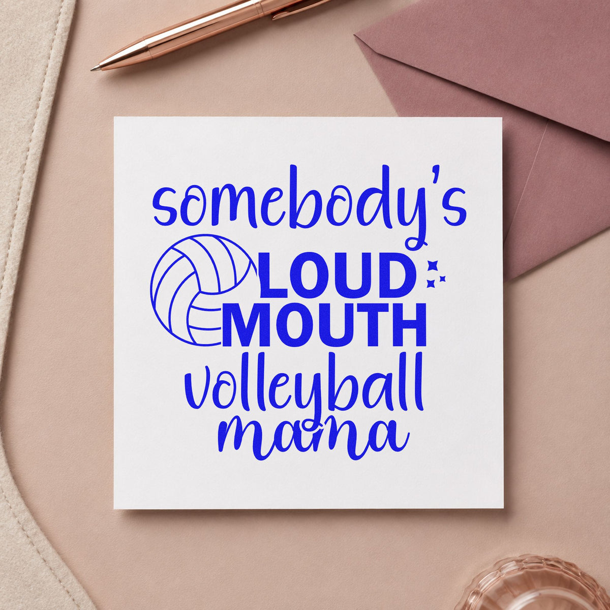 Loud Mouth Volleyball Mama craft stamp imprinted in blue ink on paper, a design suited to ticket roll seals.