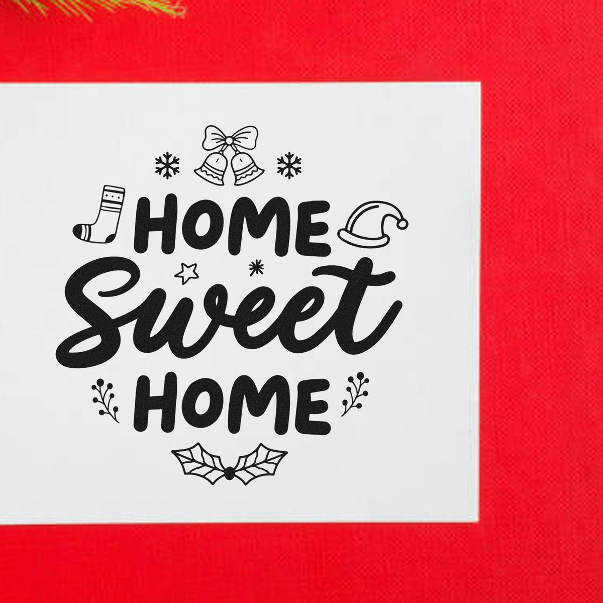 Black Home Sweet Home holiday stamp/seal design with bells, snowflakes, socks, Santa hat and holly on white card, red background.