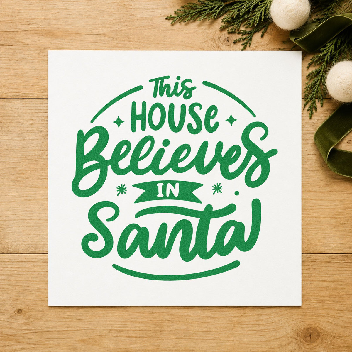 This House Believes In Santa craft stamp imprint in green ink on a handmade project, one idea being letter form pages.