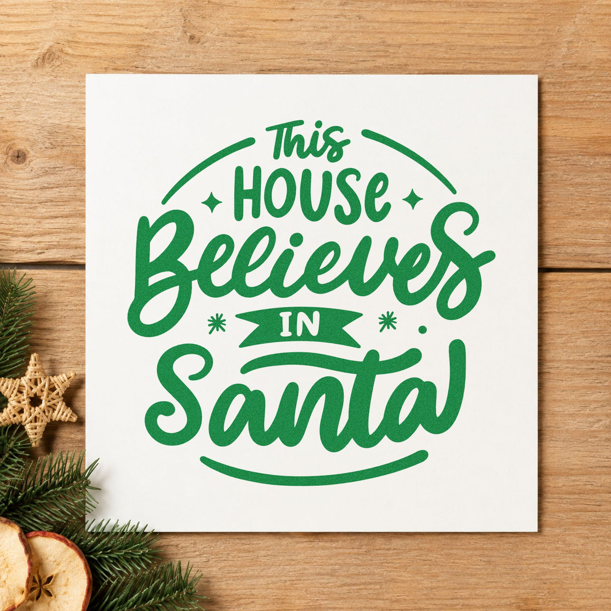 This House Believes In Santa craft stamp imprint in green ink on a handmade project, one idea being framed stair post.