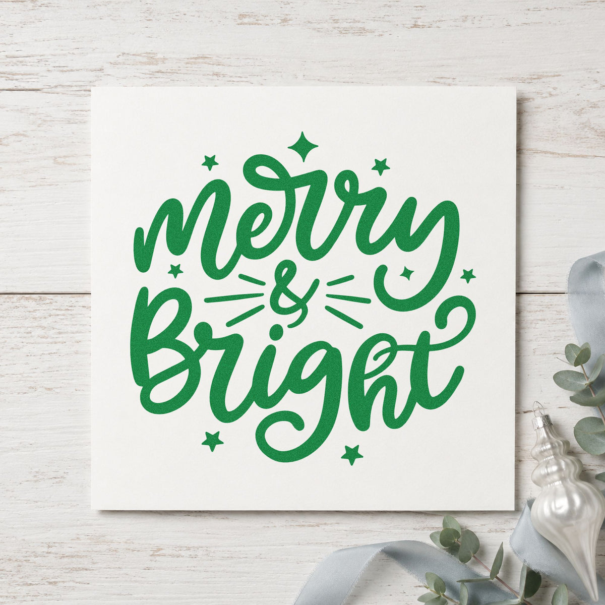 Merry And Bright Stars craft stamp imprint in green ink on a handmade project, one idea being route map pages.