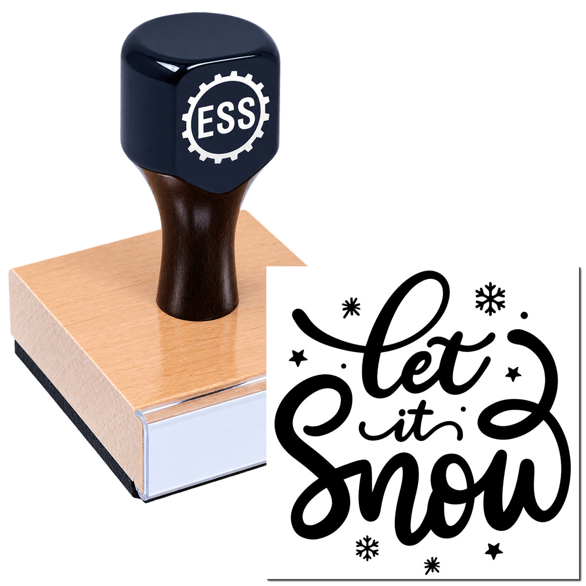 Dark navy stamp and seal on a wooden block, with black "Let it snow" script and snowflakes.