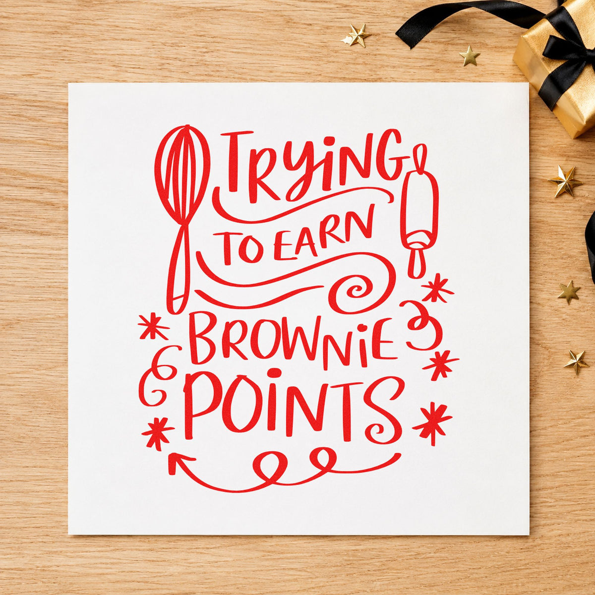Trying To Earn Brownie Points craft stamp in red ink on cardstock, an easy option for oven glove panels.
