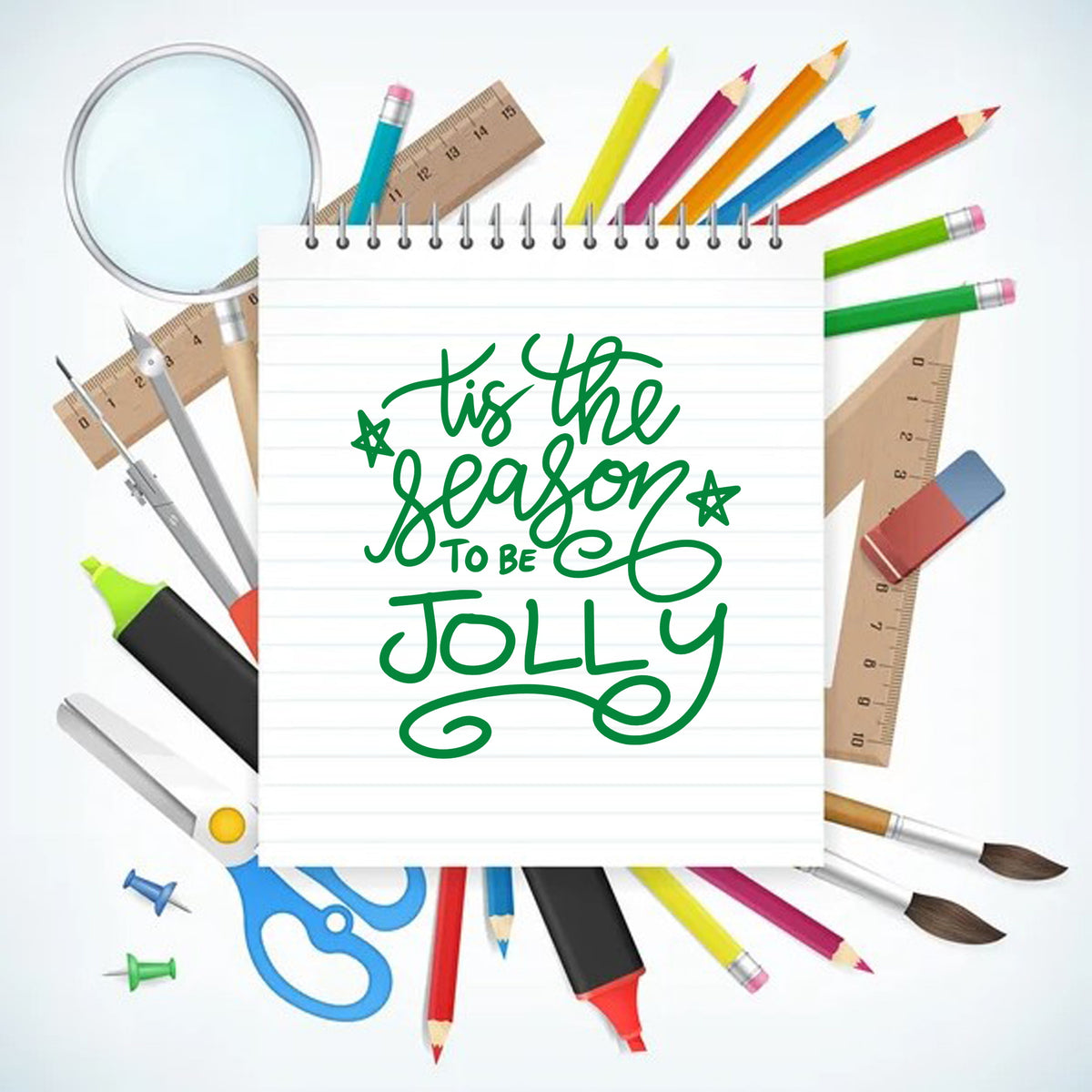 Green custom stamp and seal on a lined notebook, surrounded by colorful pencils, rulers, compass, scissors, and brushes.
