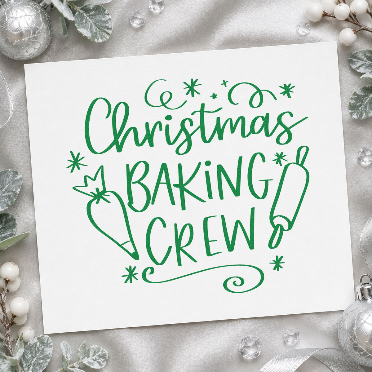 Christmas Baking Crew craft stamp imprinted in green ink on paper, a design suited to biscuit bag seals.