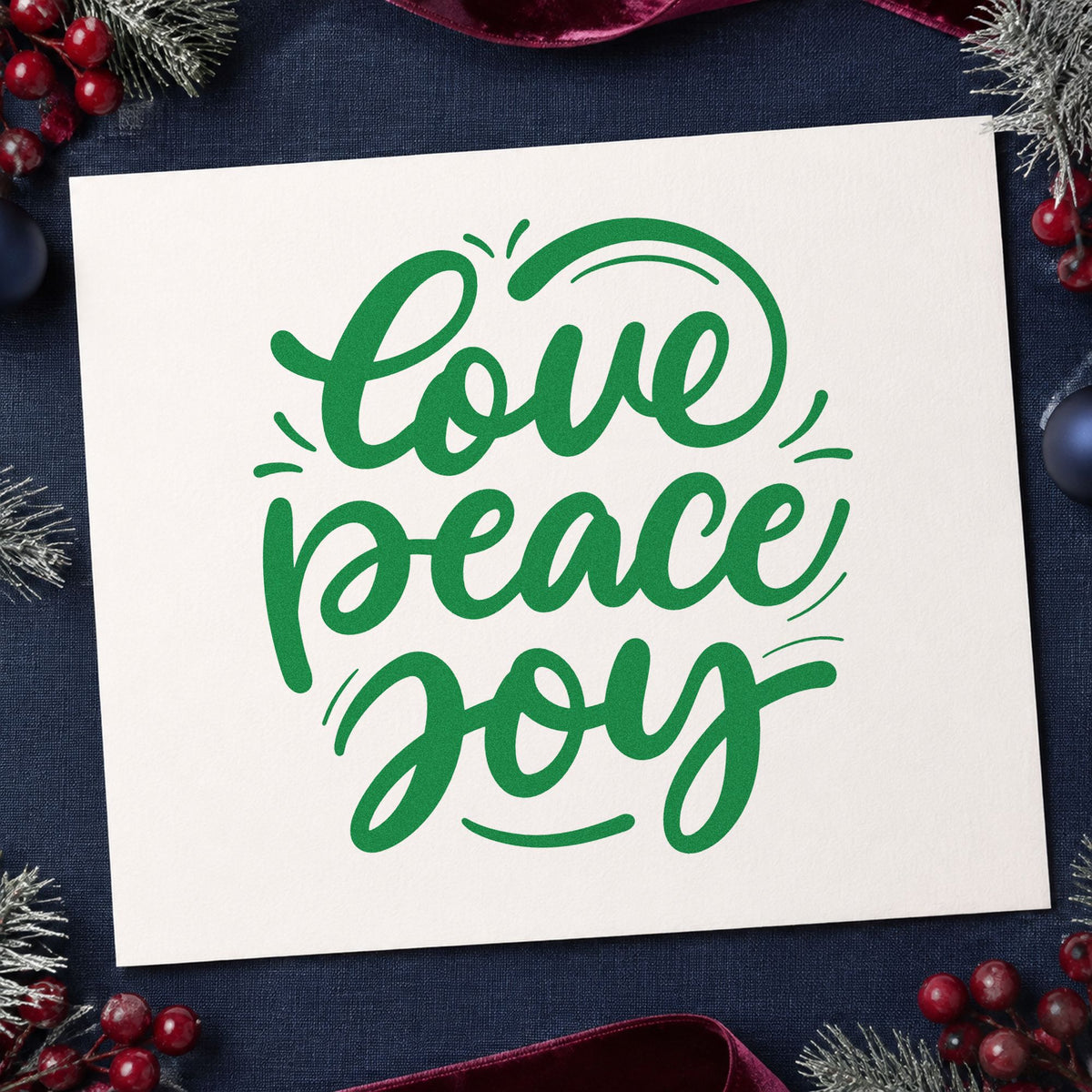 Love Peace Joy Script craft stamp imprint in green ink on a handmade project, one idea being reflection pages.