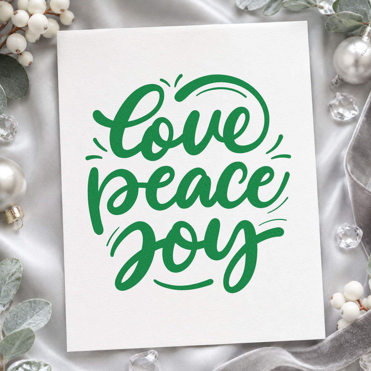 Love Peace Joy Script craft stamp imprint in green ink on a handmade project, one idea being framed hearth trio.