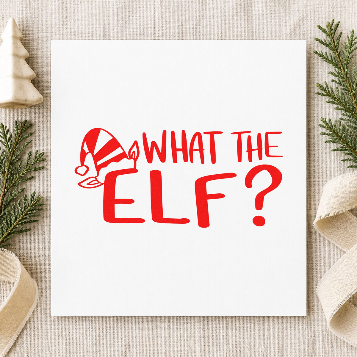What The Elf rubber stamp shown in red ink, stamped for projects such as december notes.