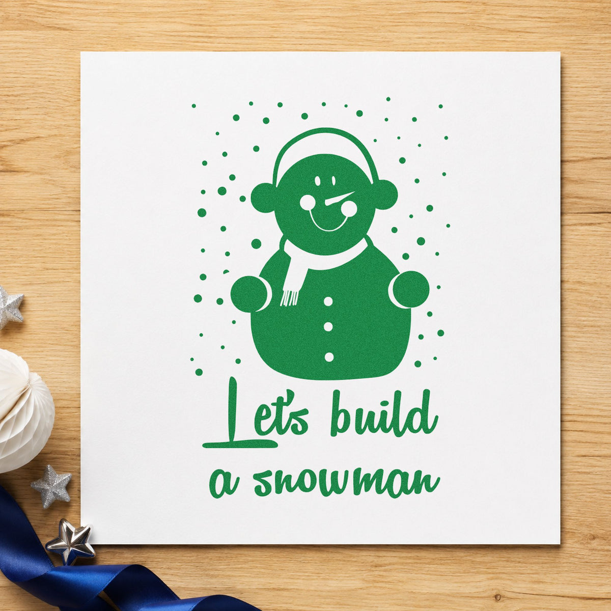 Let's Build A Snowman craft stamp imprint in green ink on a handmade project, one idea being framed boot room.