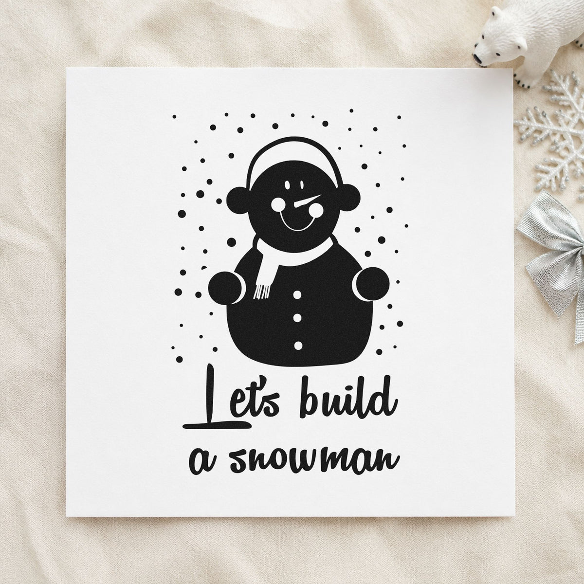 Let's Build A Snowman rubber stamp printed in black ink, ready for earmuff snowman cards and similar paper crafts.