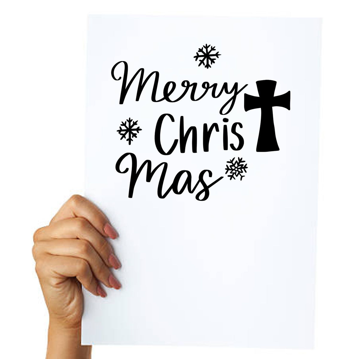 Black Christmas stamp and seal reading Merry Chris Mas with cross and snowflakes on white paper held in hand.