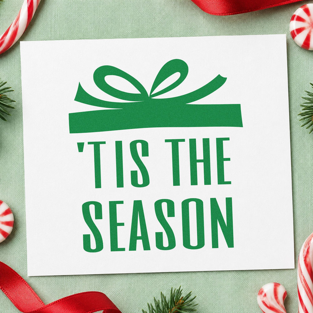 Tis The Season Gift craft stamp imprinted in green ink on paper, a design suited to framed foyer piece.