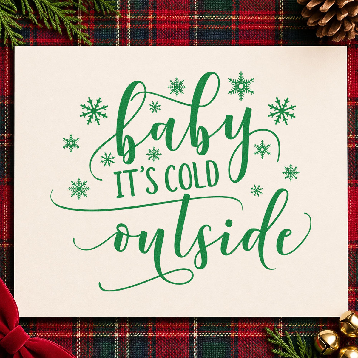 Baby It's Cold Outside craft stamp imprint in green ink on a handmade project, one idea being sledding party invites.