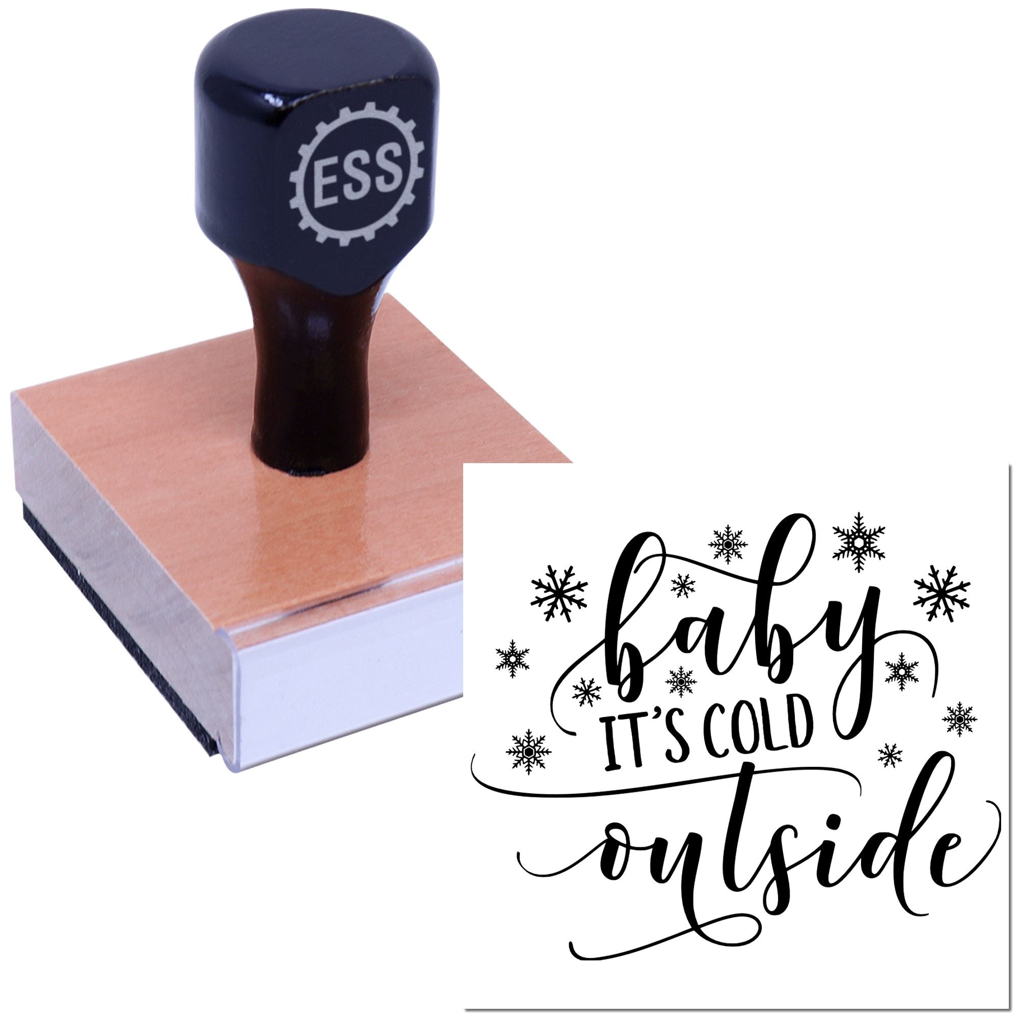 Dark navy custom stamp with ESS logo on a pink wooden block; sample seal says baby its cold outside with snowflakes.