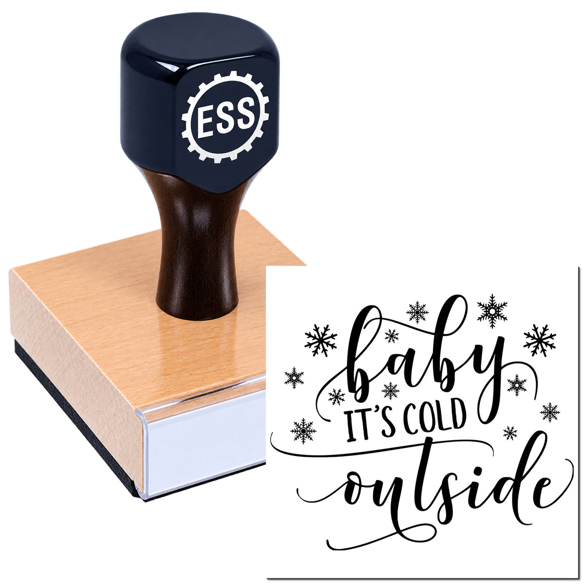Dark navy custom stamp with ESS logo on a pink wooden block; sample seal says "baby it's cold outside" with snowflakes.