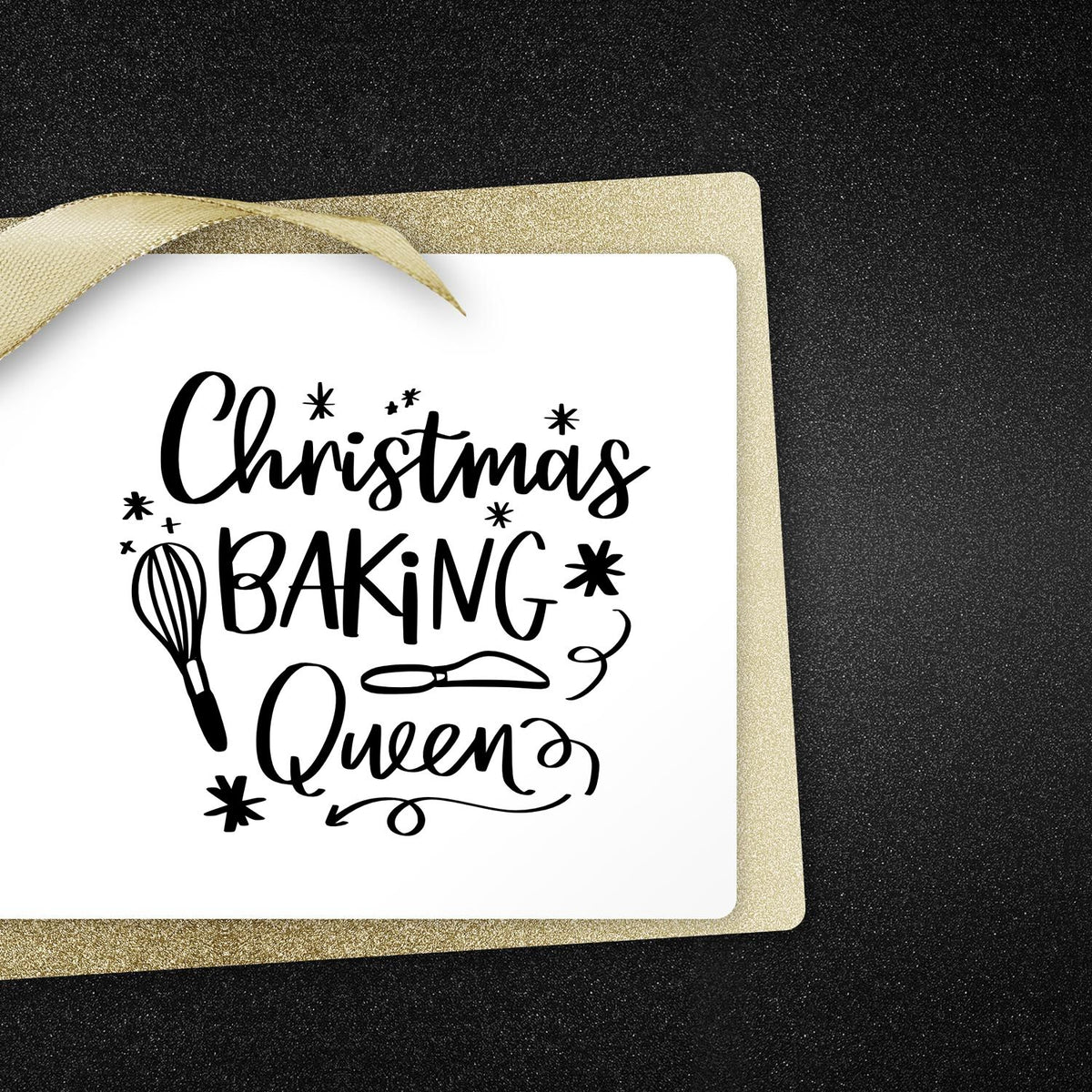 Christmas Baking Queen stamp and seal with black script, whisk and rolling pin, white square card, gold glitter border, ribbon