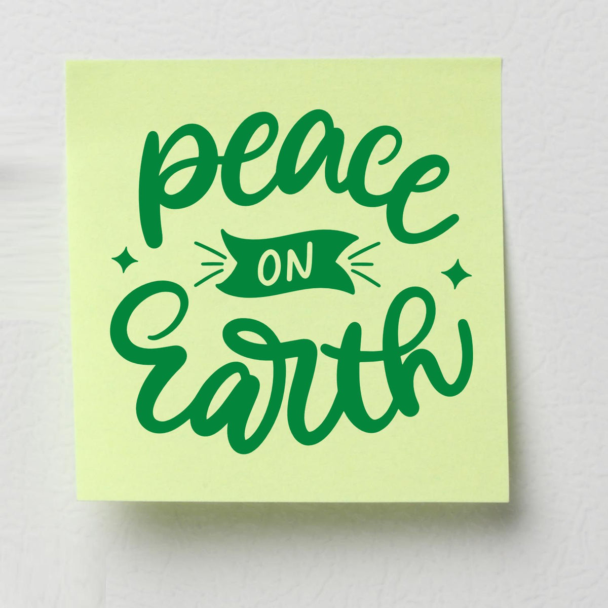 Green Peace on Earth stamp and seal design on pale yellow paper with decorative stars.