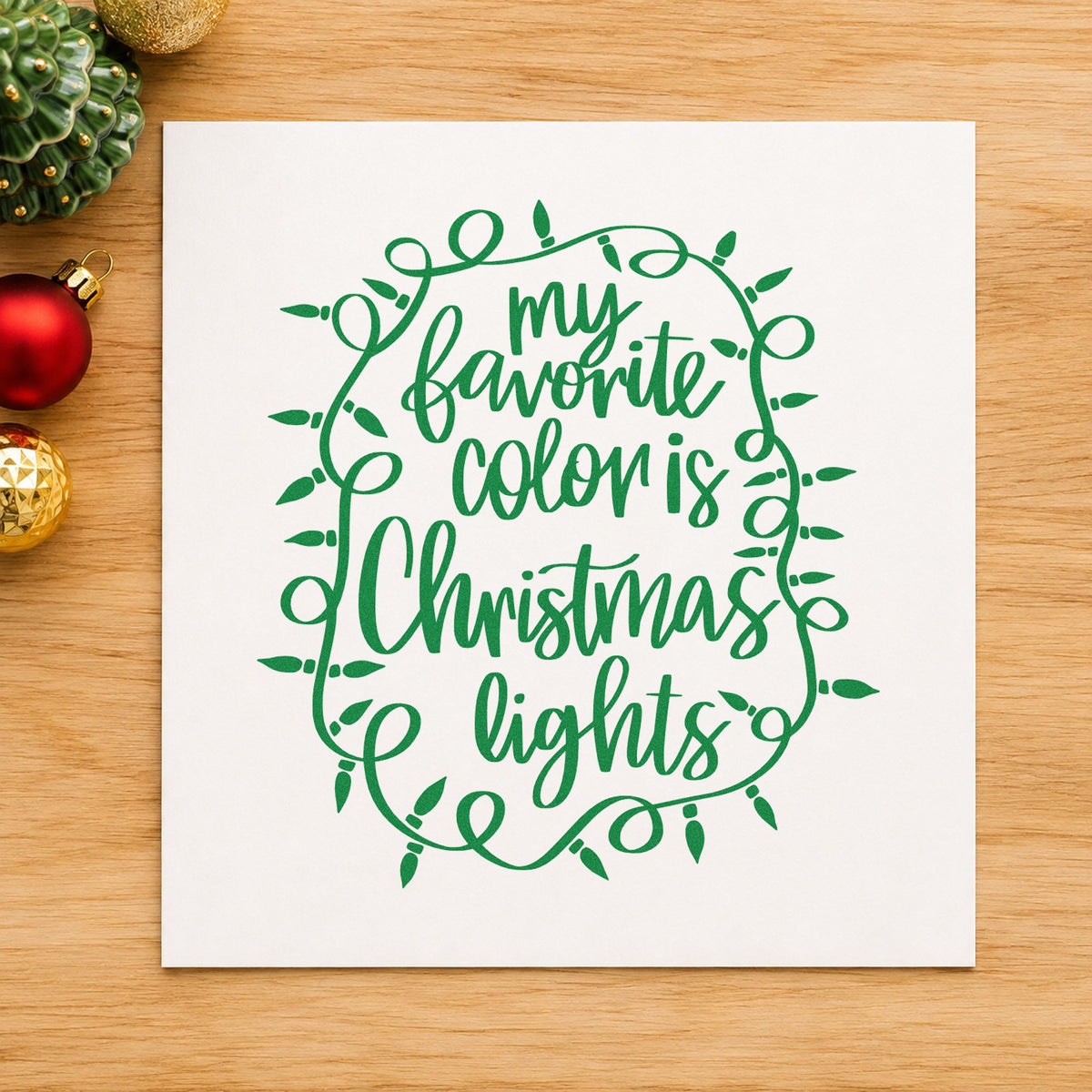 Favorite Color Christmas Lights craft stamp imprint in green ink on a handmade project, one idea being bulb ornament tags.