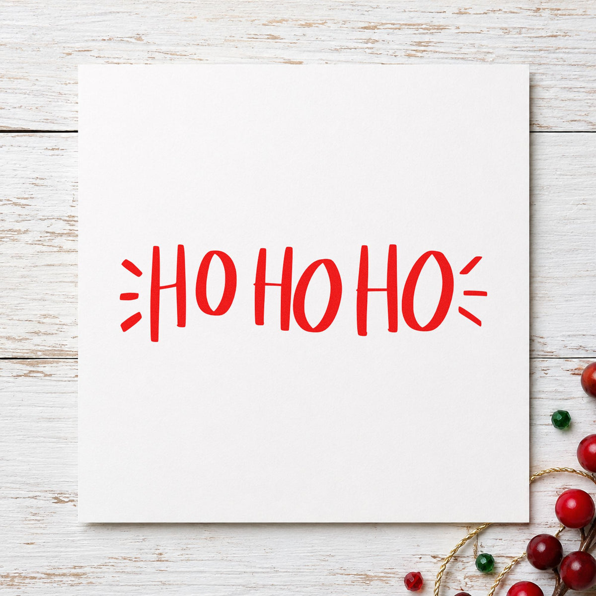 Ho Ho Ho Lettering rubber stamp shown in red ink, stamped for projects such as treat bag seals.