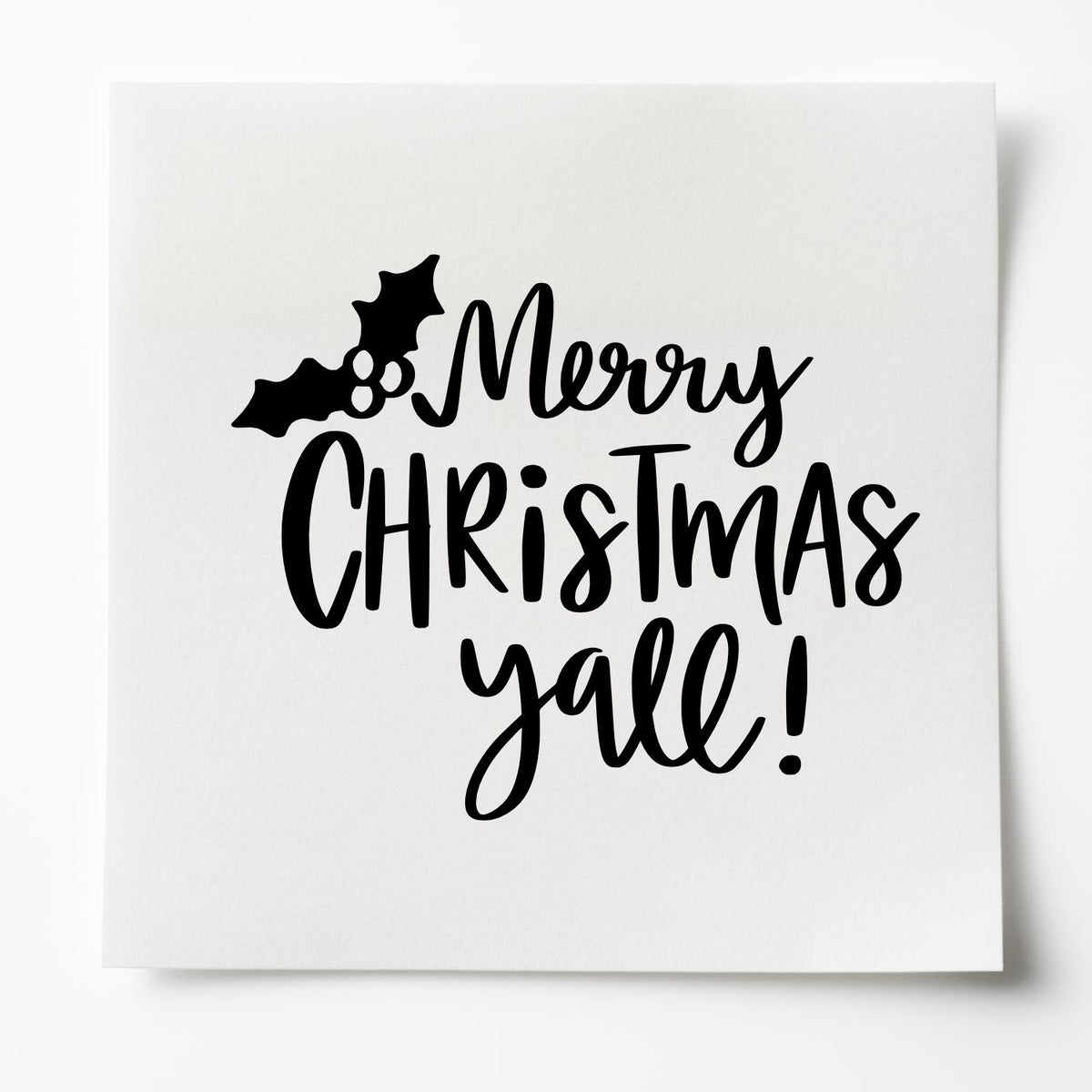 Black Merry Christmas yall stamp and seal design with holly leaves and berries on white paper.