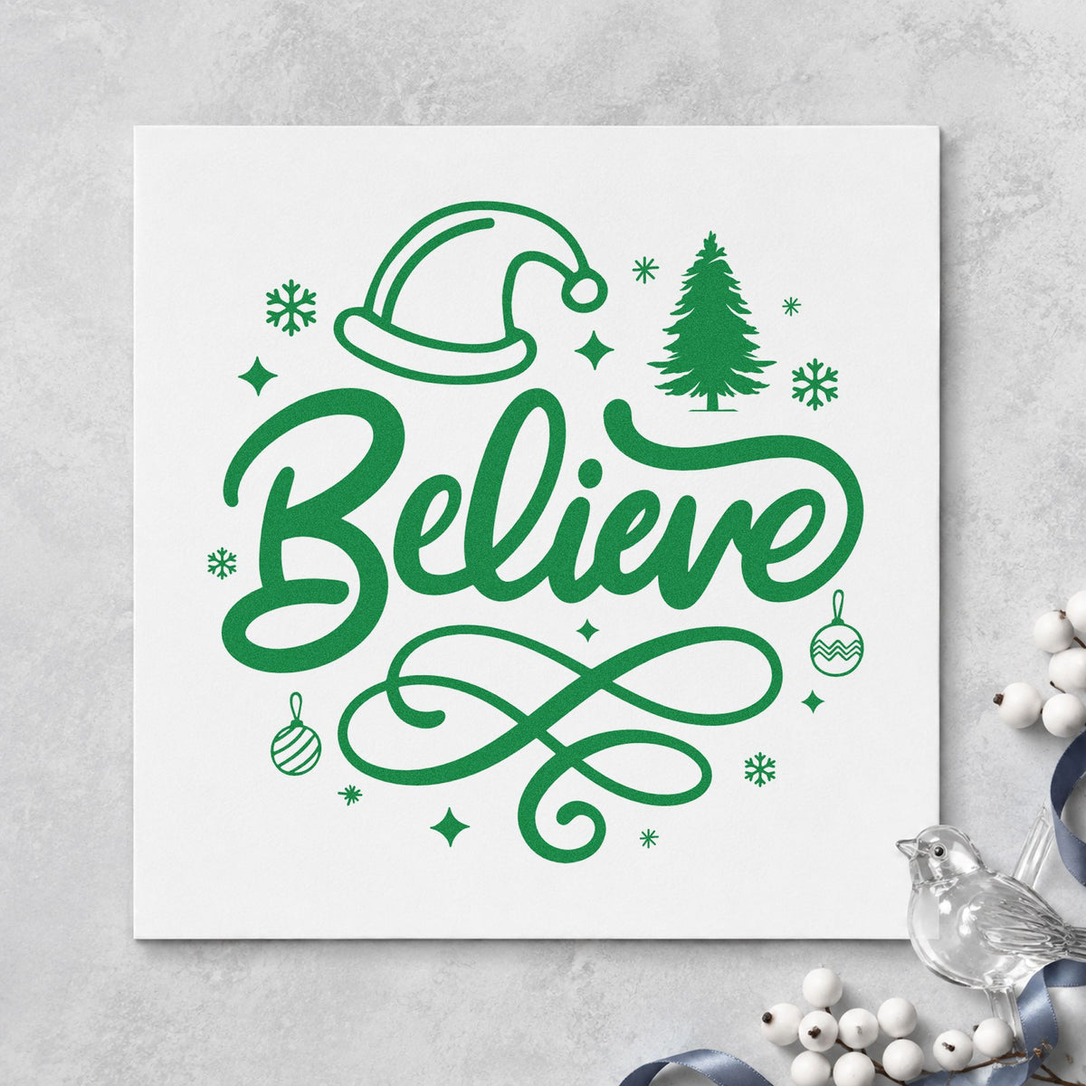 Believe Christmas Hat Tree craft stamp imprint in green ink on a handmade project, one idea being ornament box tags.
