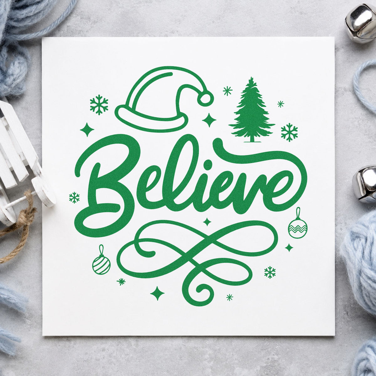 Believe Christmas Hat Tree craft stamp imprint in green ink on a handmade project, one idea being school play tickets.