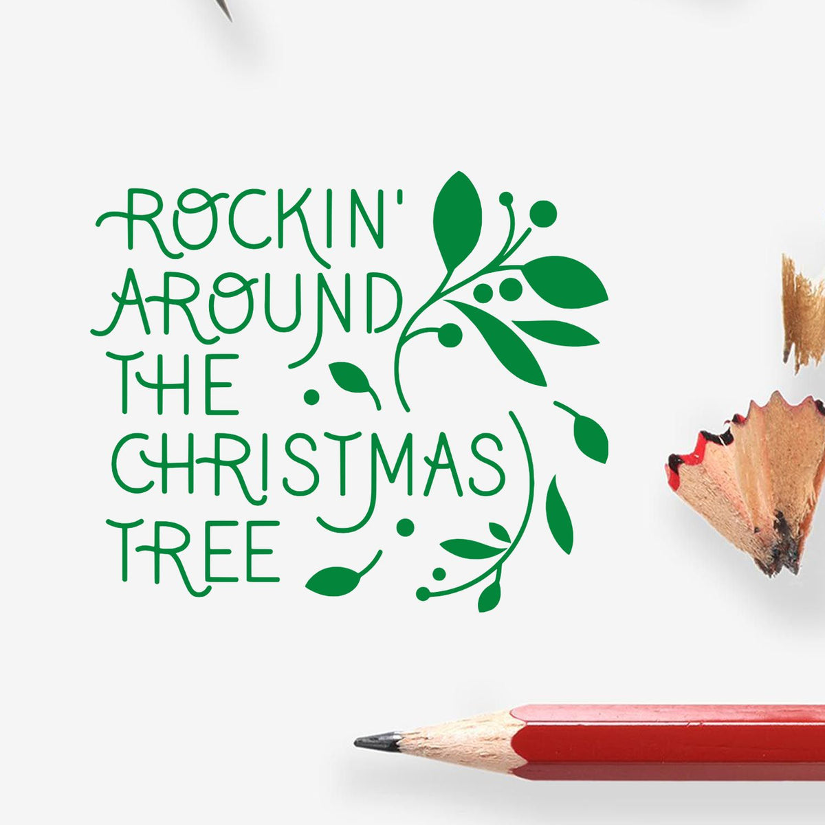 Green Rockin' Around the Christmas Tree rubber stamp and seal design with leafy wreath on white background.