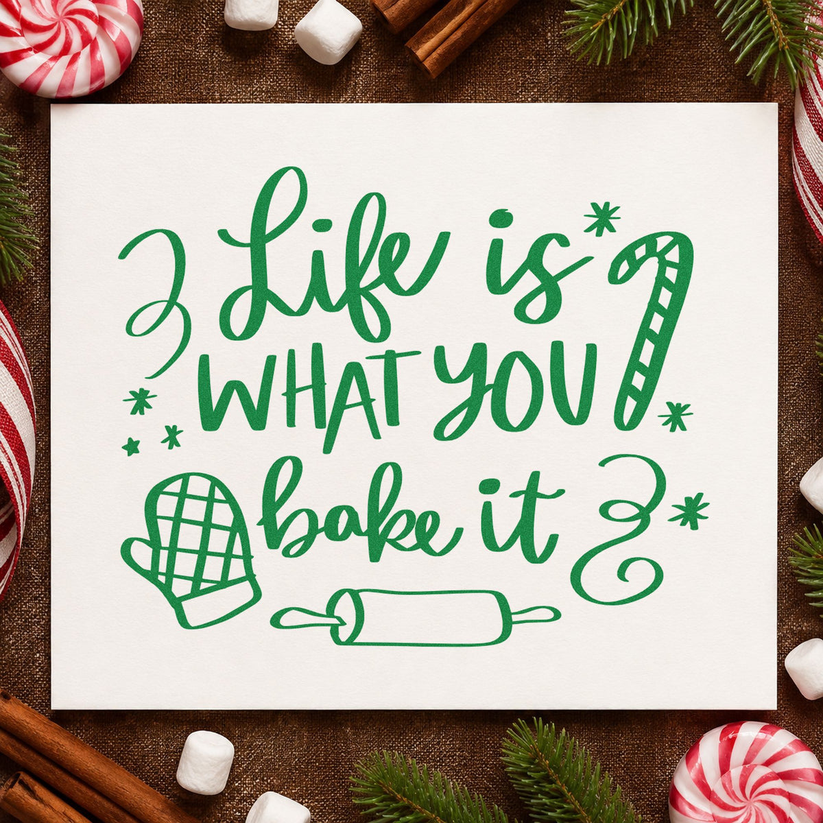 Life Is What You Bake craft stamp imprinted in green ink on paper, a design suited to framed bakery counter.