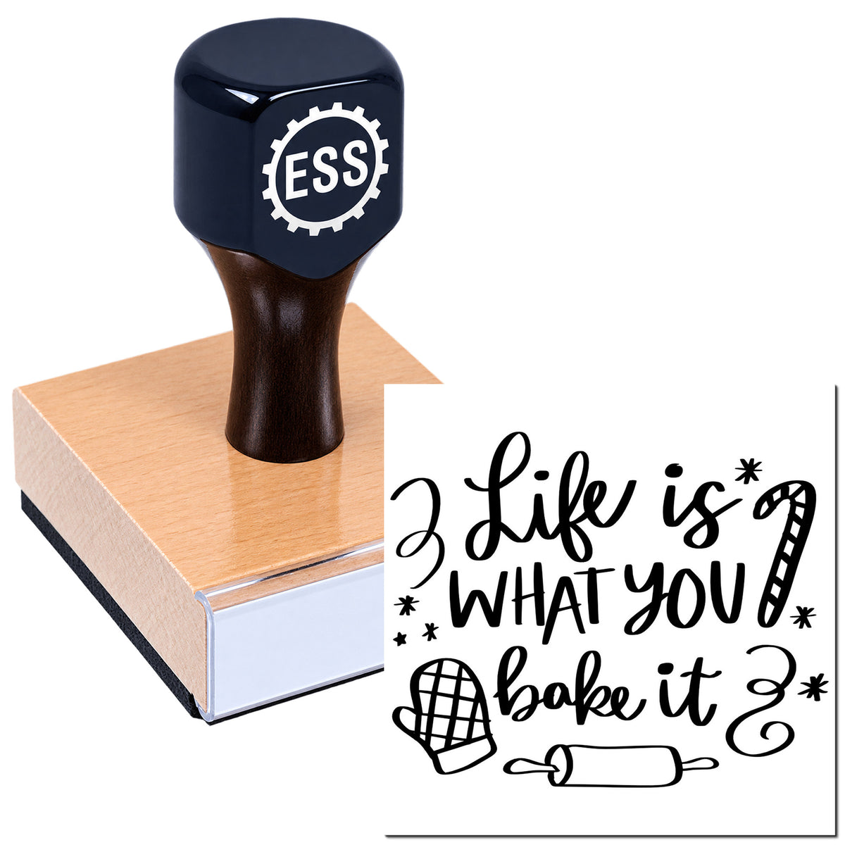 Black ESS stamp on a pink wooden seal block, showing a baking-themed "2 Like is what you bake it" design.