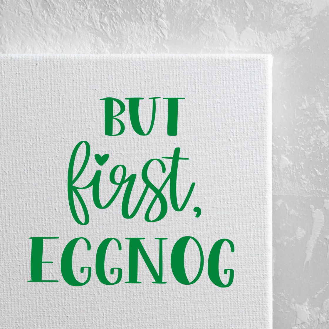 Green stamp and seal design on white textured canvas reading BUT first, EGGNOG.