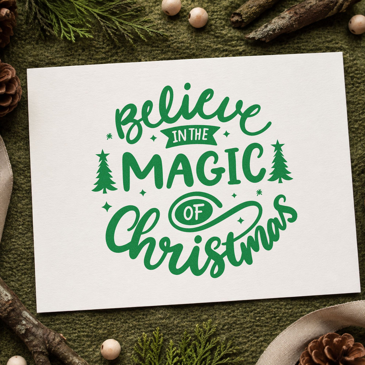 Believe Magic Of Christmas craft stamp imprint in green ink on a handmade project, one idea being lantern walk passes.