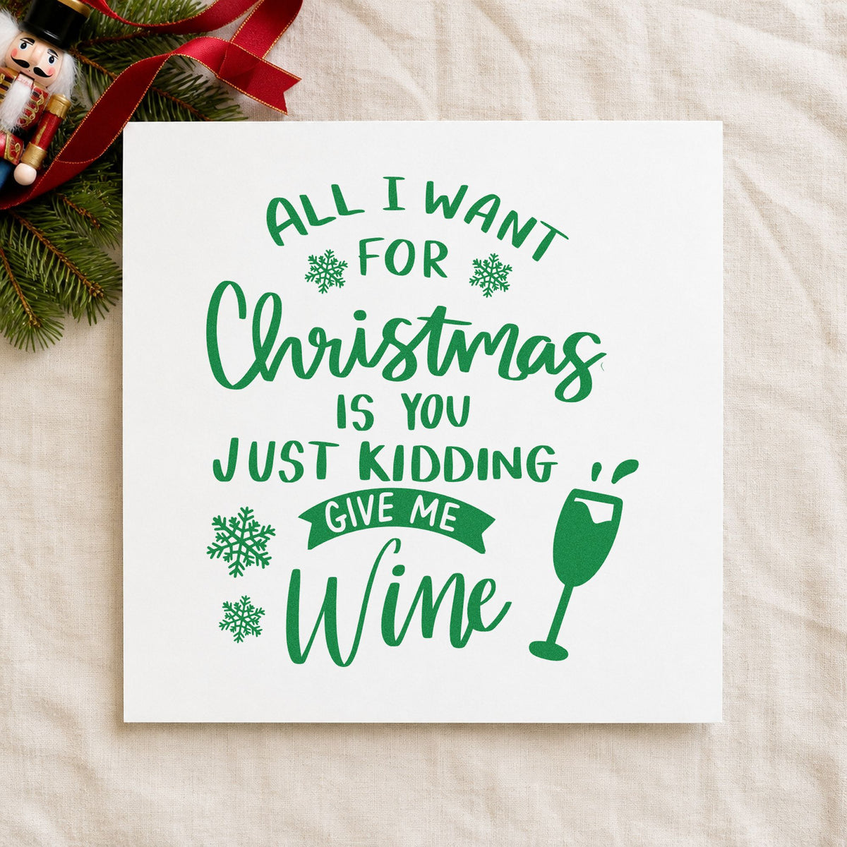 Christmas Just Give Wine craft stamp imprint in green ink on a handmade project, one idea being girls night invites.