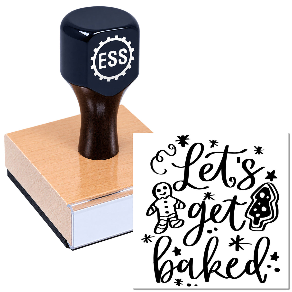 Dark navy ESS rubber stamp on a pink wooden block with black "Let's get baked" seal featuring gingerbread and tree icons.