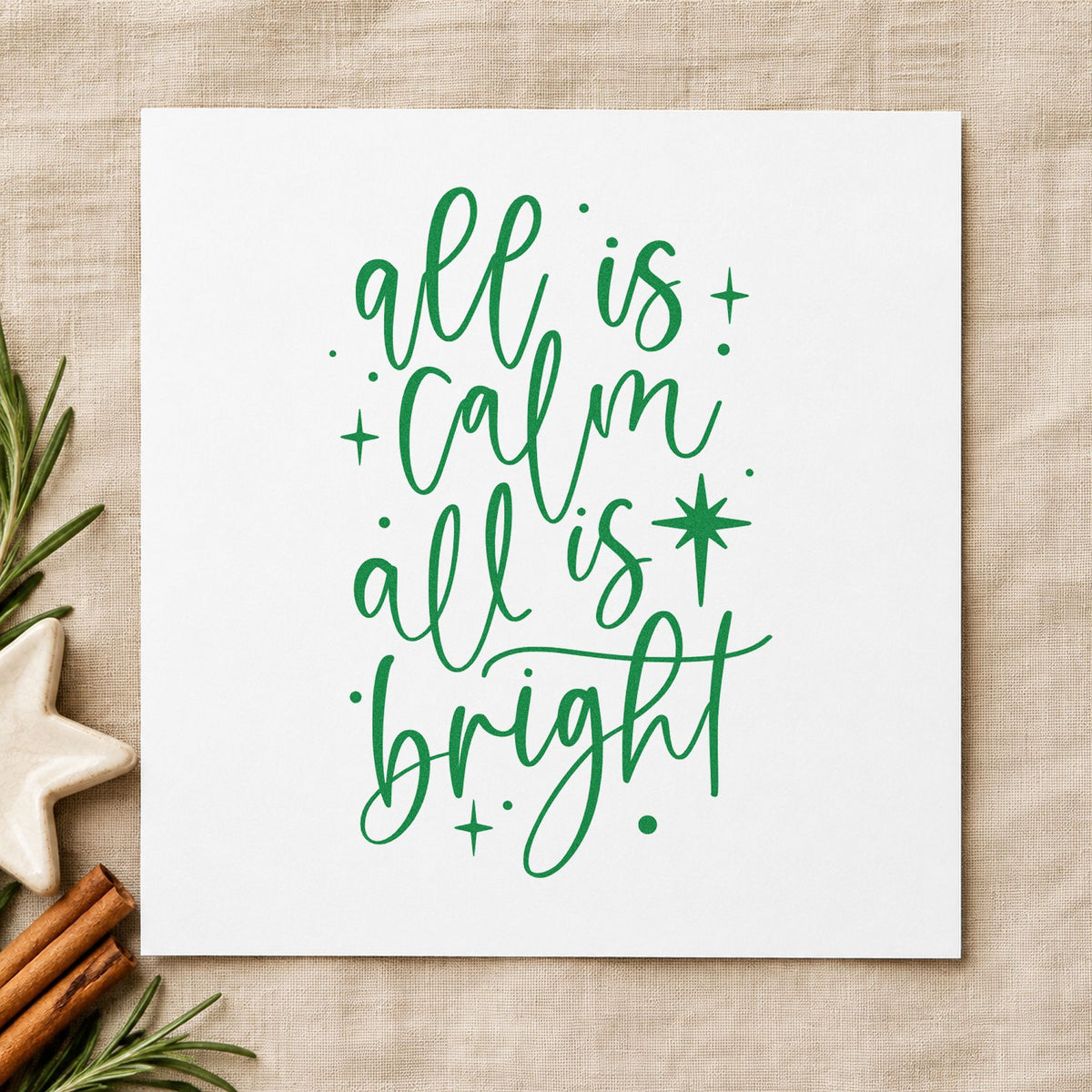 All Calm All Bright craft stamp imprint in green ink on a handmade project, one idea being candle gift tags.