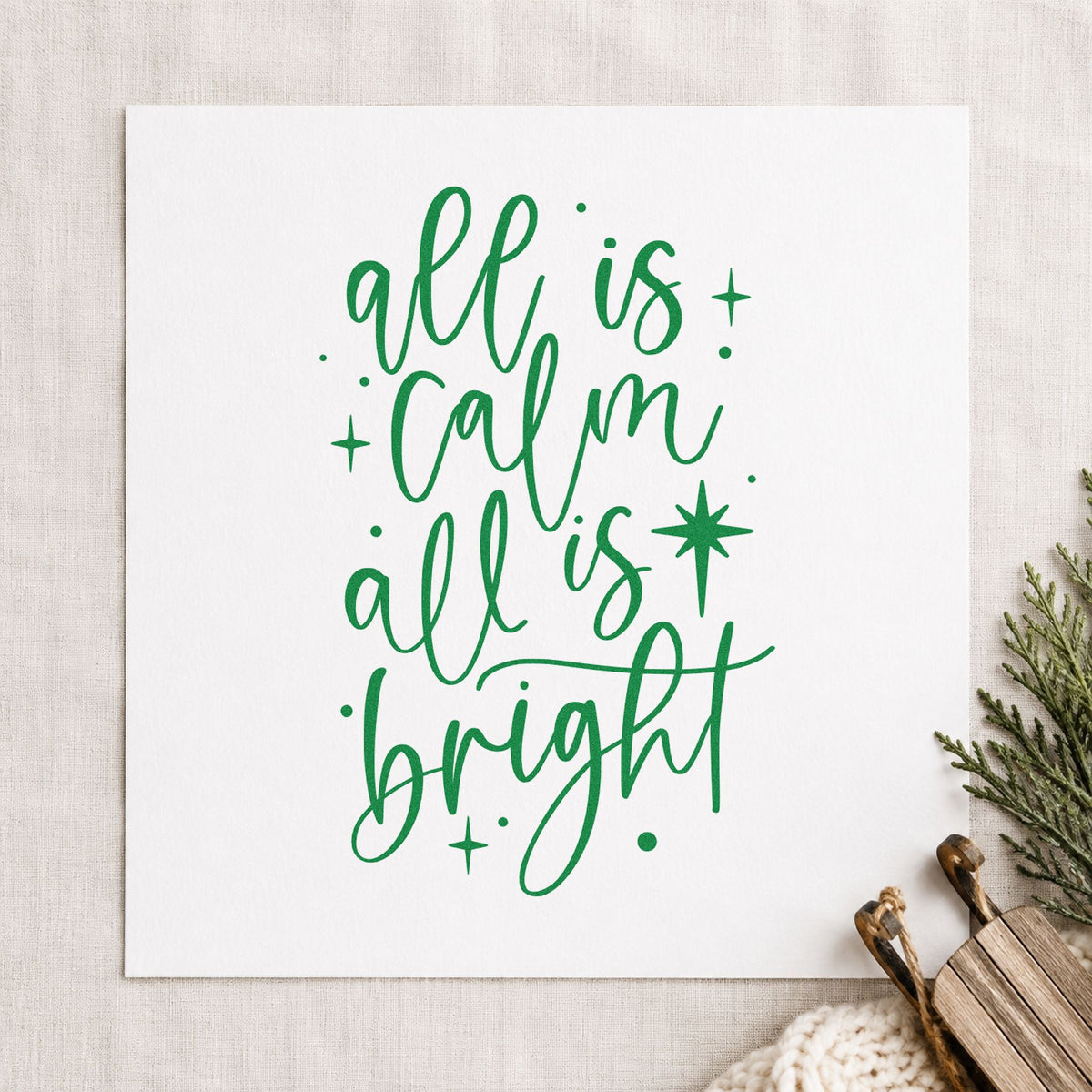 All Calm All Bright craft stamp imprint in green ink on a handmade project, one idea being winter wedding menus.