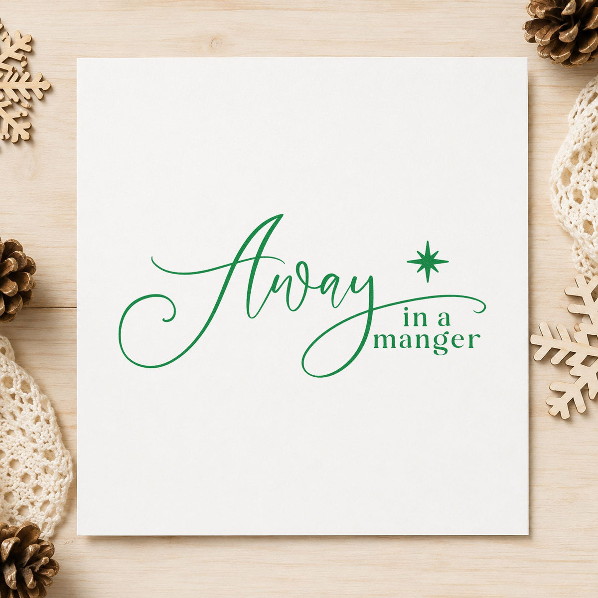 Away In A Manger craft stamp imprint in green ink on a handmade project, one idea being bible gift tags.