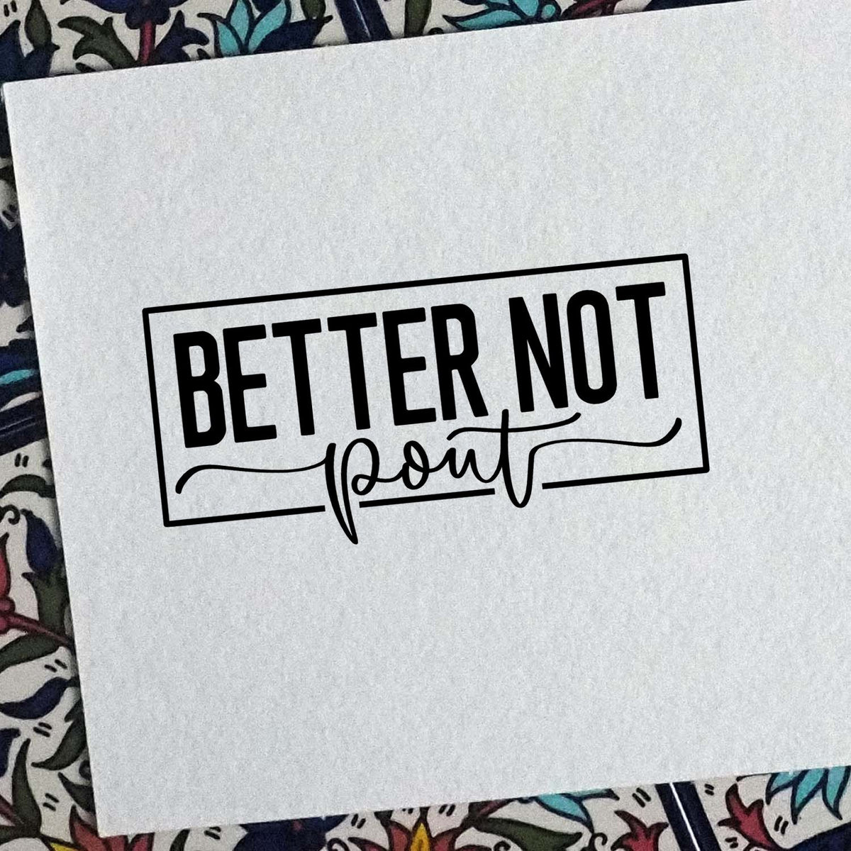 Black custom stamp seal reading BETTER NOT in bold block and script lettering on white paper.