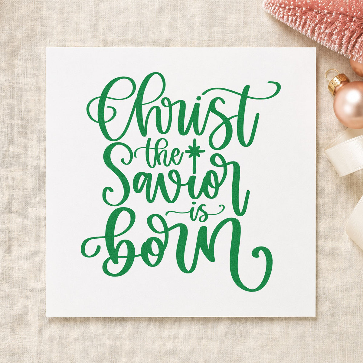 Christ The Savior Is Born craft stamp imprint in green ink on a handmade project, one idea being lessons service programs.