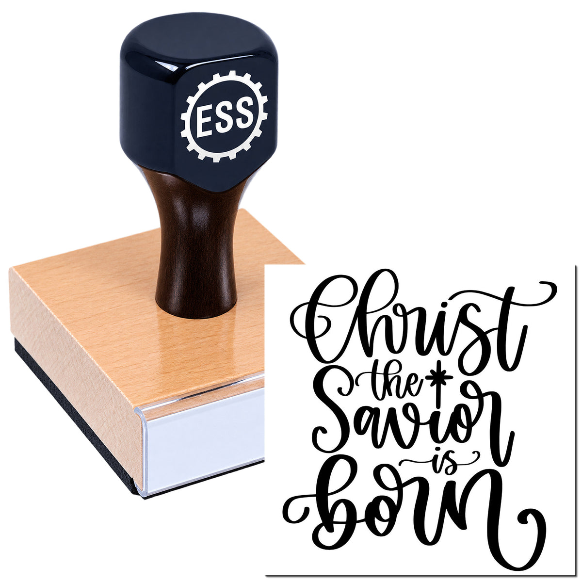 Dark navy ESS stamp handle on a pink wood seal block with black script reading "Christ the Savior is born."