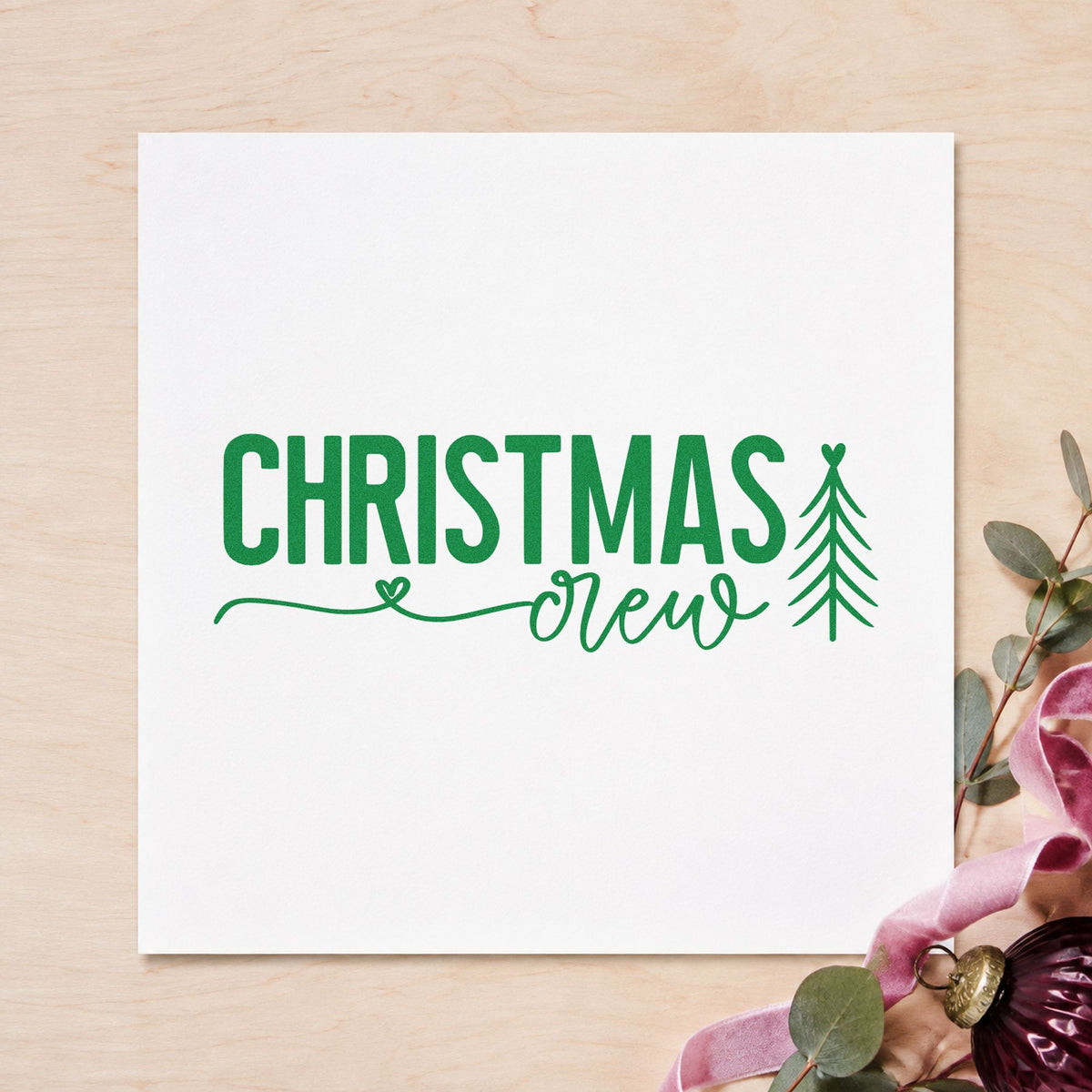 Christmas Crew With Tree craft stamp imprint in green ink on a handmade project, one idea being reunion name badges.