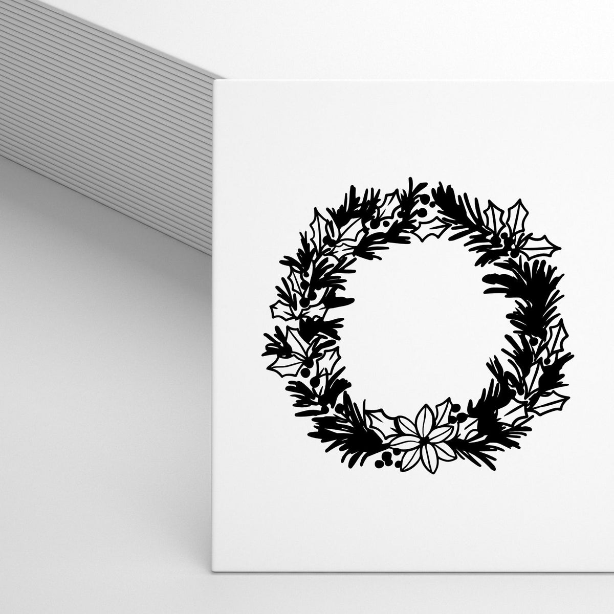 Black holiday wreath stamp and seal design on white card, with holly, pine branches, berries, and poinsettia.