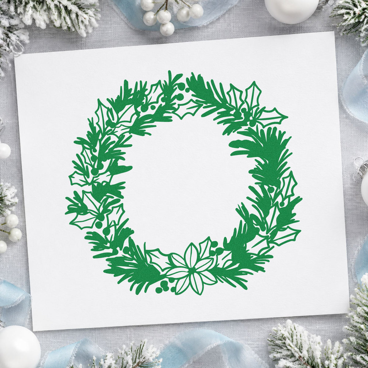 Pine Holly Floral Wreath craft stamp imprint in green ink on a handmade project, one idea being place setting rounds.