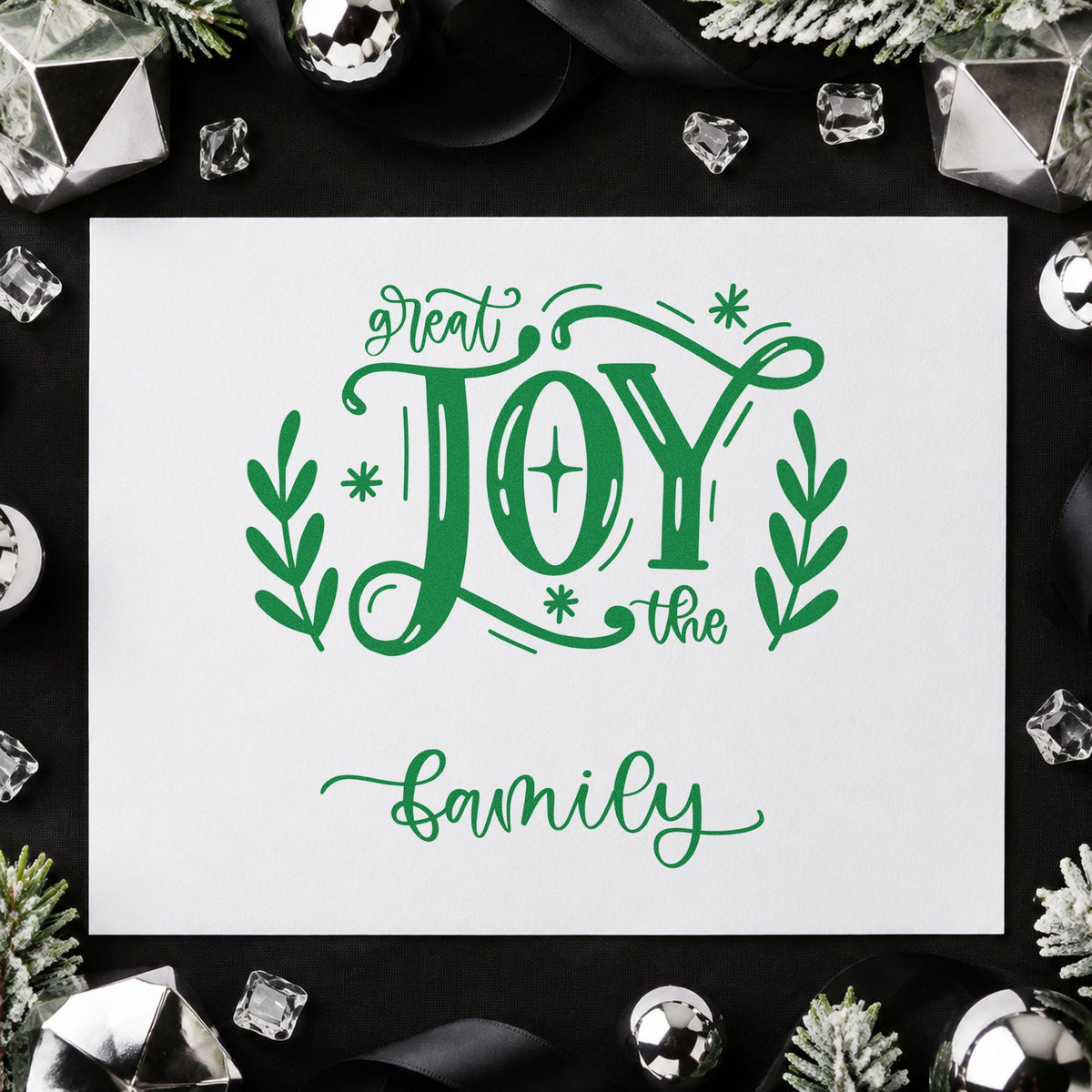Great Joy To The Family craft stamp imprinted in green ink on paper, a design suited to framed dining wall.